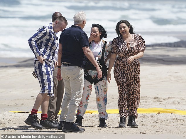 Martin, 64, was wearing a navy polo top with cream chinos for his skydive, while Aitch, 25, wore a matching blue and white striped co-ord