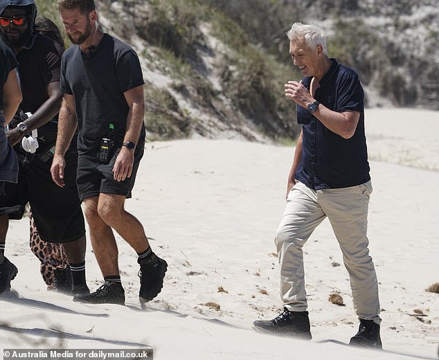 Martin walked alongside the member of crew