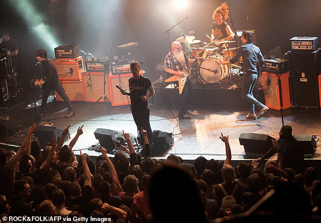 American rock group Eagles of Death Metal perform on stage on November 13, 2015 at the Bataclan concert hall in Paris, a few moments before four men armed with assault rifles and shouting 'Allahu akbar' ('God is great!') stormed into the venue
