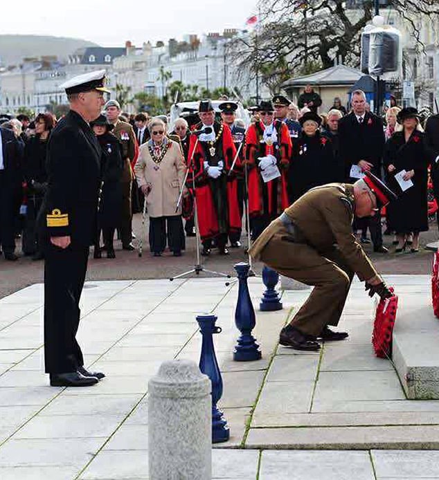 Jonathan Carley pictured in Lladudno this year where he saluted the war memorial