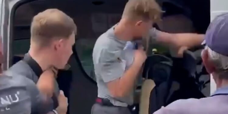 Shocking moment Brit tourist brawls with fellow traveller after 'man put his bare feet against his headrest'