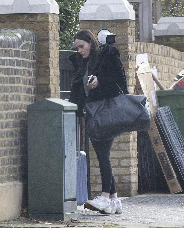 She wore a faux-fur coat to up the glamour of the otherwise pared-back ensemble