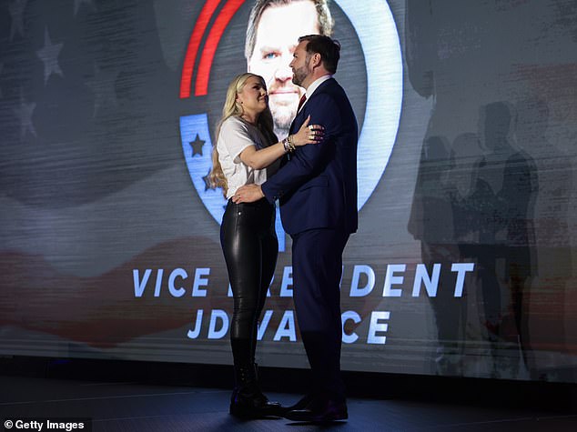Erika Kirk, widow of the Turning Point USA founder, and Vice-President JD Vance embrace on stage during a Turning Point USA event at the Pavilion at Ole Miss at the University of Mississippi, on October 29