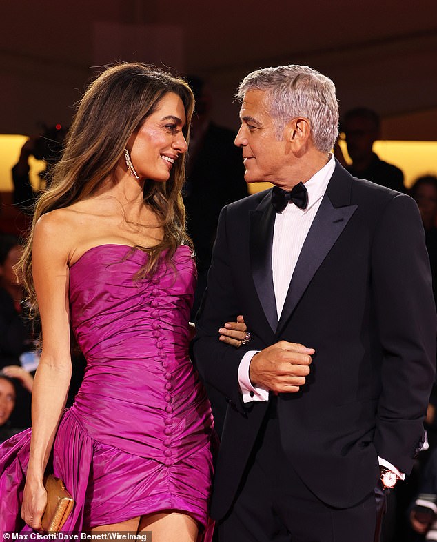 Clooney, with husband George, 64, at the Venice Film festival premiere of his film, Jay Kelly, in August. The actress was said to have undergone a 'non-surgical' facelift before the event