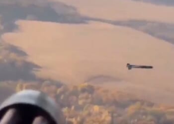 Stunning moment Ukrainian helicopter shoots down Russian drone mid-air with fast-firing minigun blitz