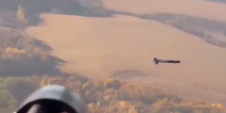 Stunning moment Ukrainian helicopter shoots down Russian drone mid-air with fast-firing minigun blitz