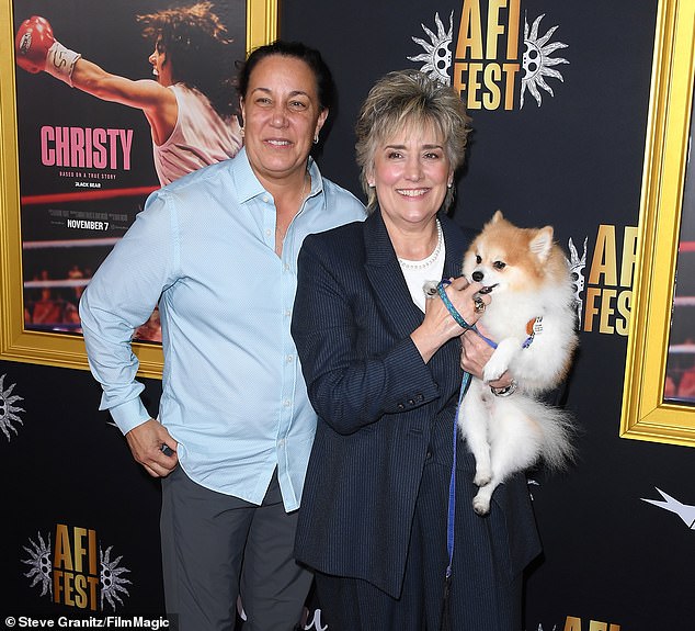 Martin's ex-husband James V. Martin is still serving a 25-year prison sentence at Graceville Correctional Facility for stabbing and shooting her in 2010, but she survived the attack and went on to marry former ring rival Lisa Holewyne (L, pictured October 25)