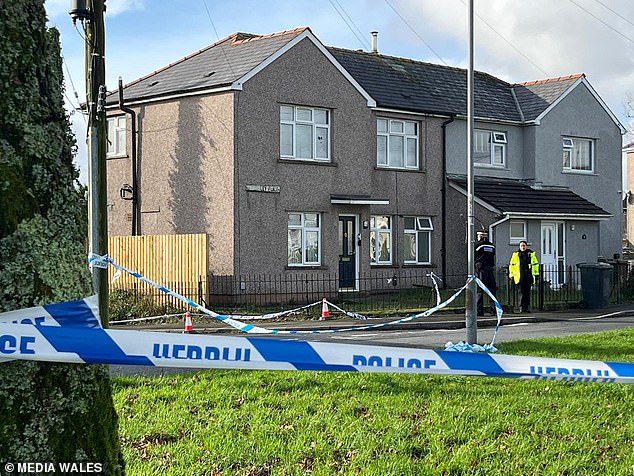 Police at the scene on Wheatley Place in the Cefn Fforest area of Blackwood, Gwent,on Thursday morning