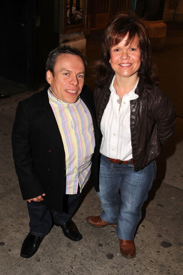 Warwick Davis and Samantha Davis pose backstage at "How to Succeed in Business Without Really Trying" on Broadway.