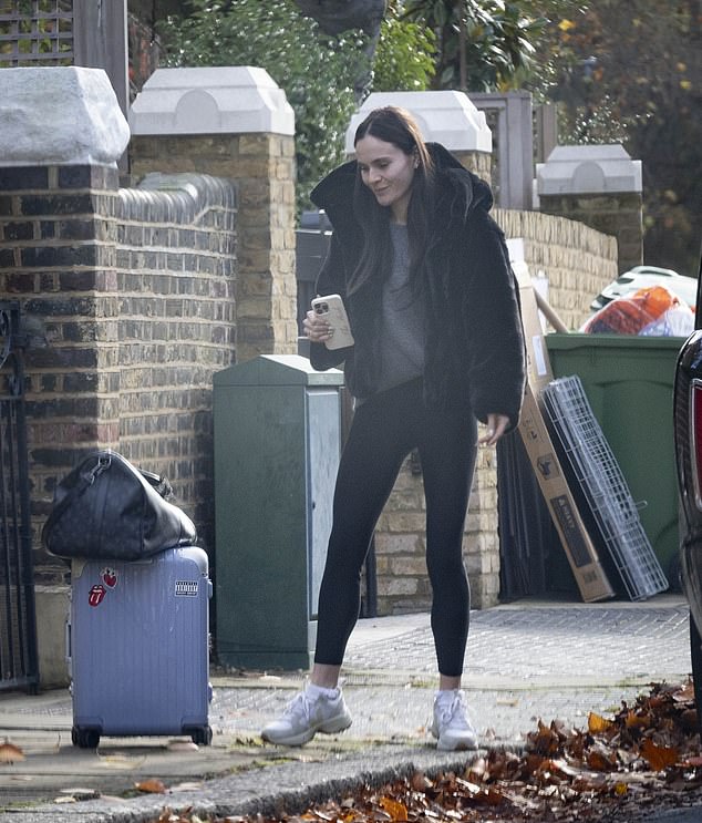 Holly was clutching a 'Bride' phone case when she broke cover on Thursday morning for the first time since her feud with fiancé Adam Peaty's family came to light