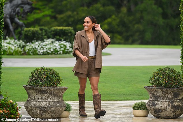 Former Lioness Alex Scott, 41, was wearing suitable Jungle attire with brown biker boots and a brown linen shirt dress