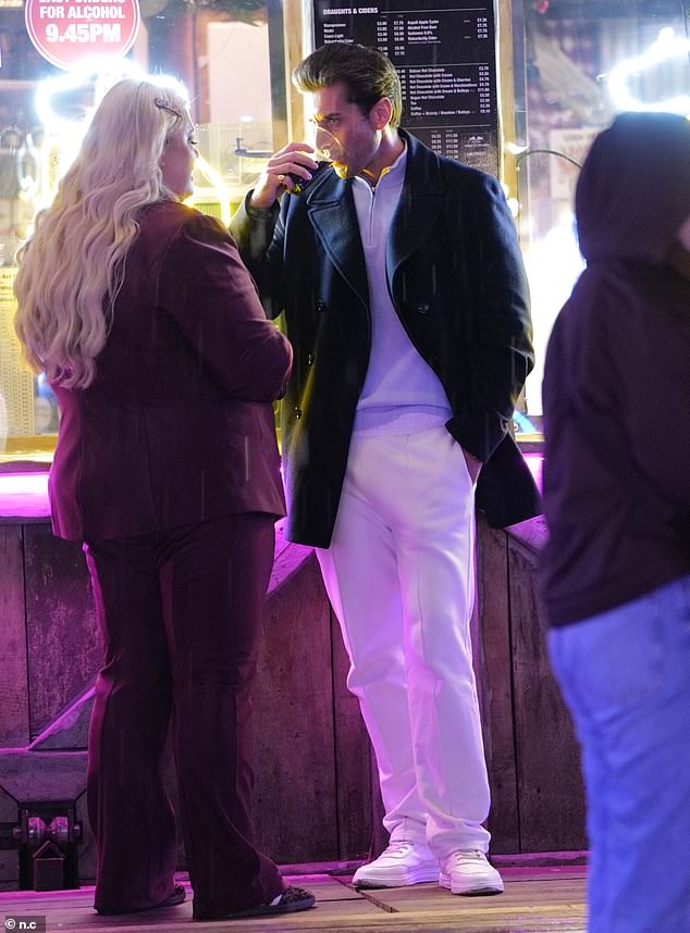 The exes looked in good spirits as they caught up alongside a group of friends at the festive soiree