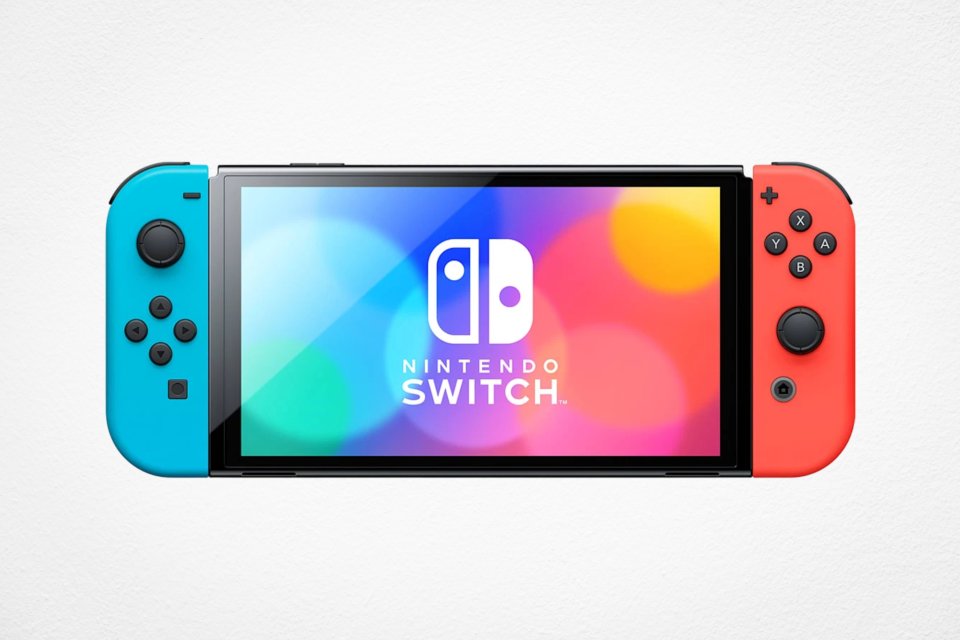 A Nintendo Switch console with blue and red Joy-Cons attached, displaying the Nintendo Switch logo on a colorful background.