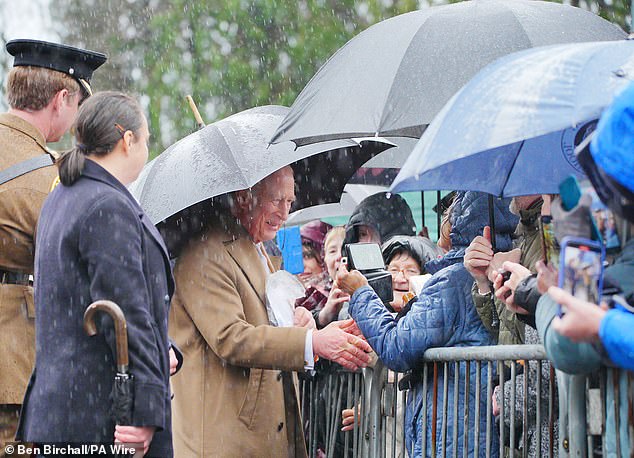 The King meets wellwishers as he leaves after a visit to Cyfarthfa Castle