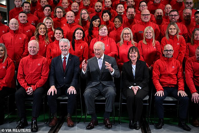 Deputy First Minister of Wales, Huw Irranca-Davies, King Charles, Secretary of State for Wales, Jo Stevens pose with staff during a visit to Taff's Well Transport Depot