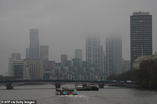 A wet start to the day in Central London today as a boat travels along the River Thames