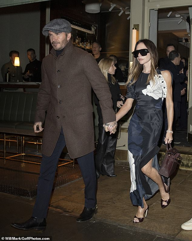 She teamed with matching peep toe heels and heavily tinted sunglasses