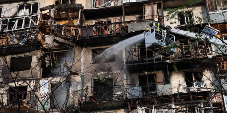 Russia hammers Kyiv with hundreds of drones killing six and injuring dozens as apartment building is hit directly