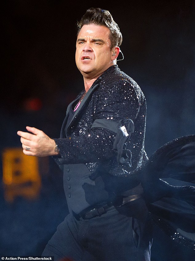 Two years ago, Robbie revealed that his two stone weight loss was thanks to 'something like Ozempic' (Pictured in 2013)