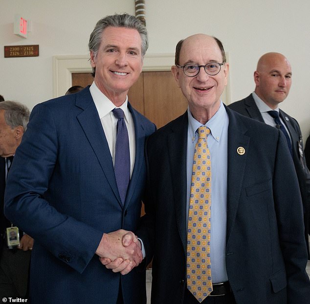 Sherman, pictured next to California governor Gavin Newsom, represents the west coast state's 32nd congressional district