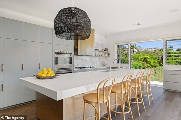 A Calacatta marble kitchen with premium appliances anchors the main level of Clarke’s $20million Vaucluse residence