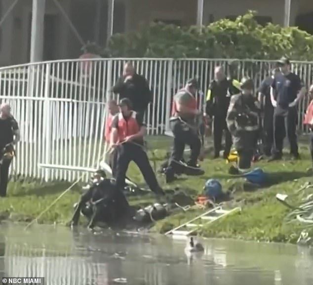 Fire and rescue crews at the small pond in Coral Springs, Florida, after the crash on Monday