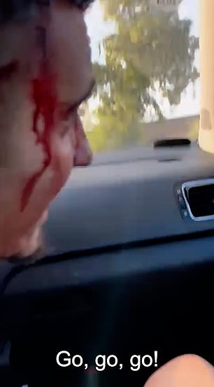 One of the passengers is seen with blood streaming down his face in the chilling footage