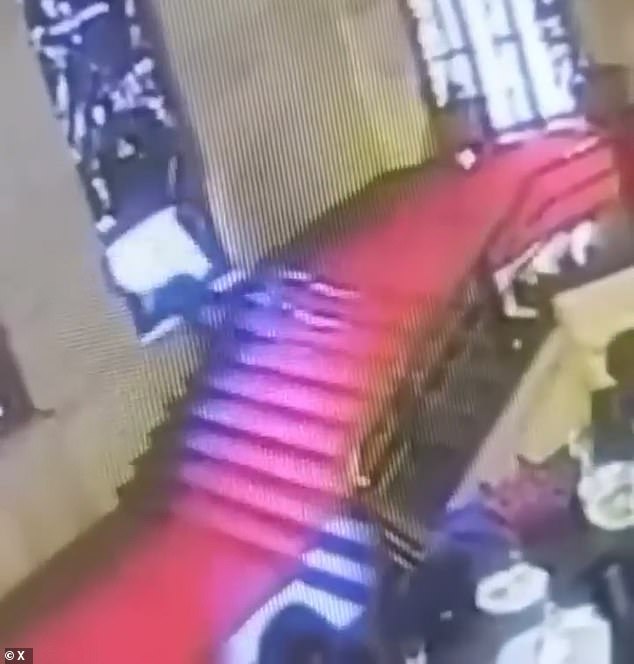 His head crashes violently into the stained-glass window, which immediately collapses upon impact