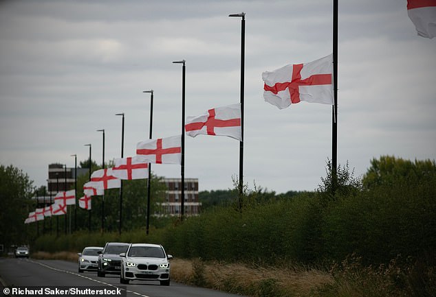 Numerous councils have removed unauthorised flags from lampposts and road signs, citing significant safety concerns, as well as fears they could cause division. Pictured: Bartley Green in Birmingham