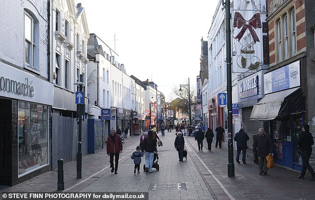 Residents of the Medway towns have accused their local council of being 'treasonous' after it spent more than £11,500 on removing 750 St George's and union jack flags. Pictured: The High Street in Chatham