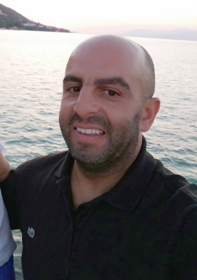 Samir Zitouni, London North Eastern Railway staff member, smiling in front of the sea.