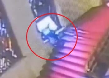 Humiliating moment politician stumbles and falls head first through priceless stained-glass window