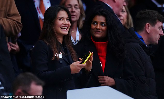Meanwhile, Simone cut a fashionable figure, snuggled up in a dark black coat contrasted with a bright red jumper, coupled with gold hoop earrings