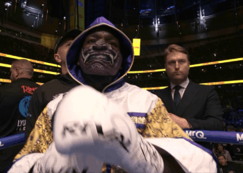 Why does Ekow Essuman wear a mask to the ring?