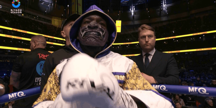 Why does Ekow Essuman wear a mask to the ring?