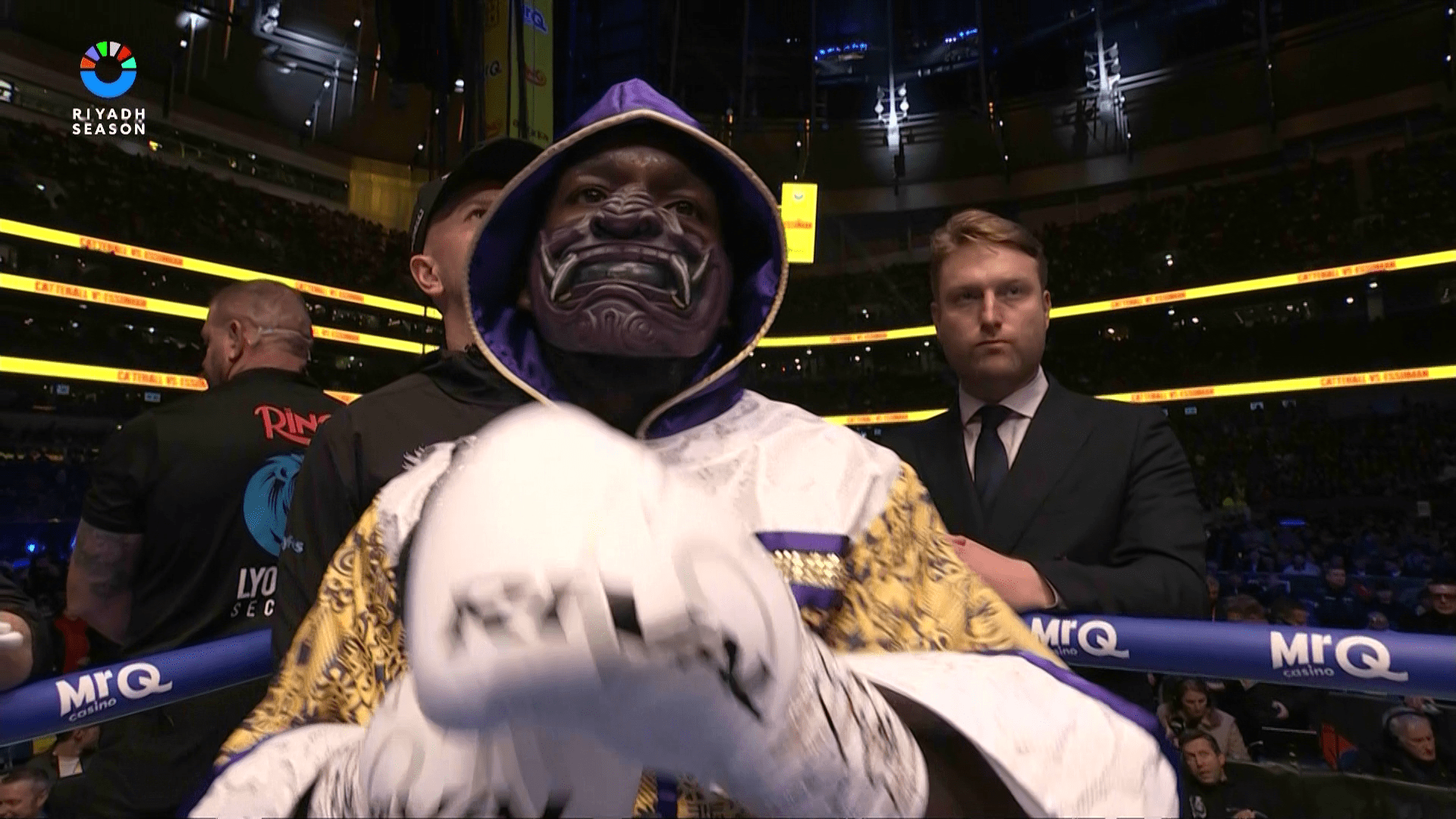 Why does Ekow Essuman wear a mask to the ring?