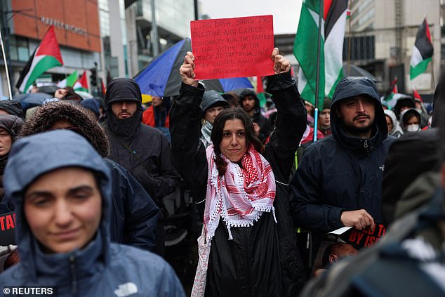 People take part in a demonstration organised by GM Friends of Palestine at Manchester Cathedral on October 4, 2025