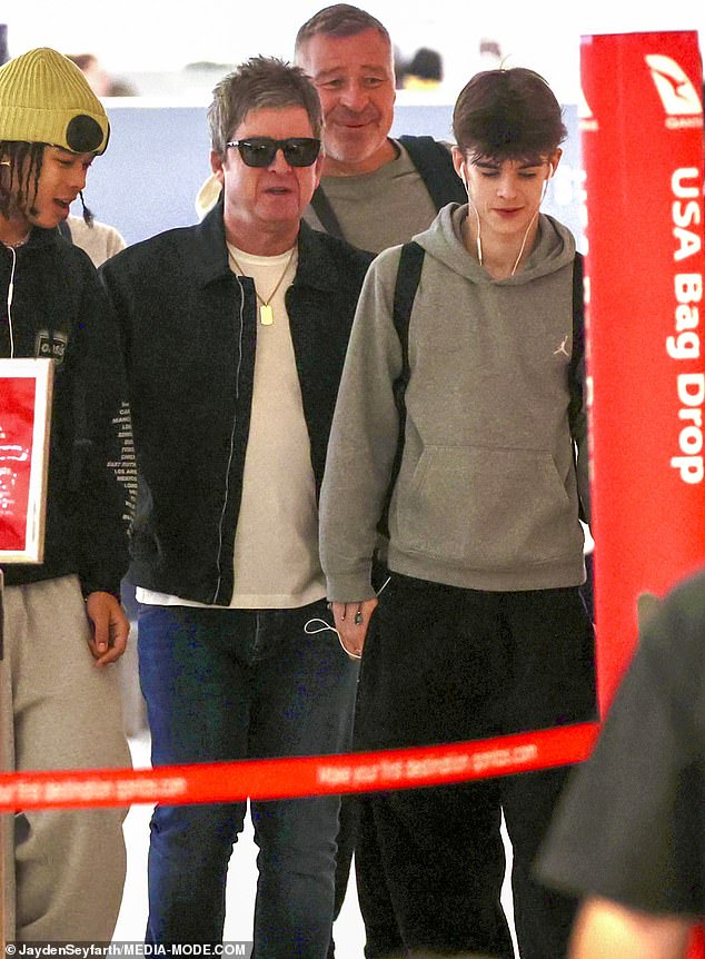 Noel appeared in high spirits as he strolled through the terminal, leaving left Australia following five sold-out concerts in Sydney and Melbourne