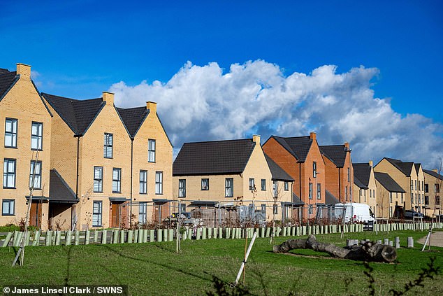 Construction traffic continues to move along residential streets with cars parked on proposed bike lanes which have not yet opened