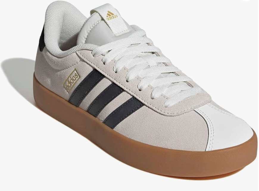 Adidas trainers with white laces, brown sole, and black stripes.