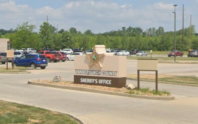 Vanderburgh County Sheriff's Office sign at the entrance to a parking lot.