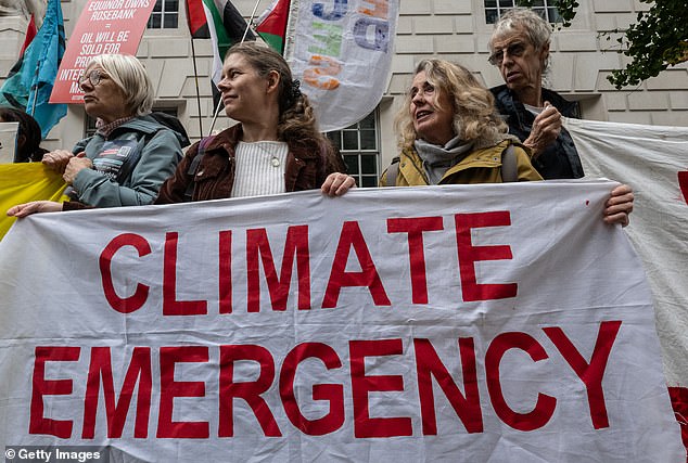 Climate protesters demonstrate outside London's Department of Energy Security and Net Zero, however, Lindzen said net zero policies will only prevent a tiny amount of warming