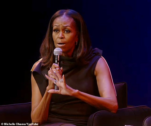 'Let me explain something to white people. Our hair comes out of our head naturally in a curly pattern,' Michelle said. 'When we straighten it to follow your beauty standards, we are trapped'