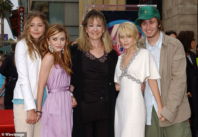 While people will be familiar with Mary-Kate, Ashley and Elizabeth Olsen, they also have a brother, Trent (pictured alongside mother Jarnette in 2004)