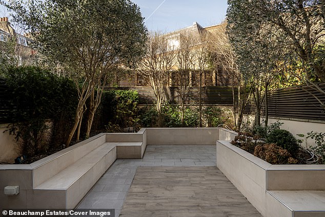 The house also has a private courtyard garden (pictured)