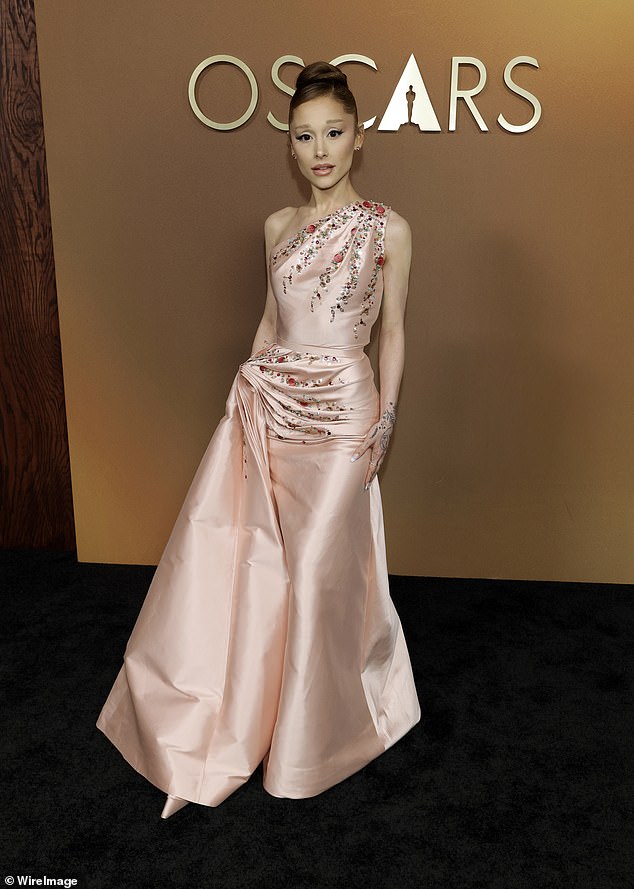 Ariana Grande, 32, wowed in a delicate one-shoulder pale pink vintage Dior gown designed by John Galliano