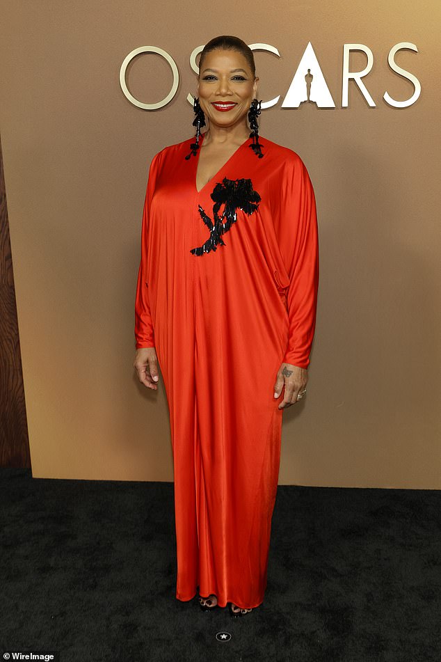 Queen Latifah sported an unflattering bright red number by Lanvin featuring an unusual shiny fringed design at the chest.