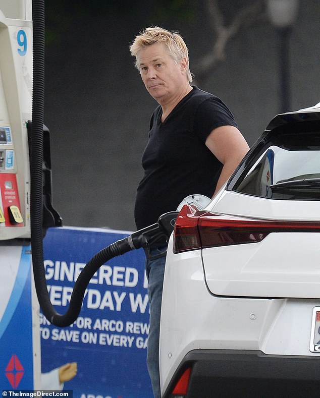 Gone were his iconic long blond waves, replaced by a short and spiky hairdo that was graying on the sides