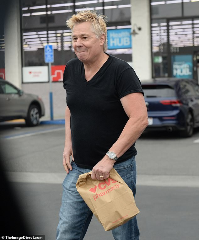 Kaelin was dressed casually for a day out in a black V-neck T-shirt and jeans