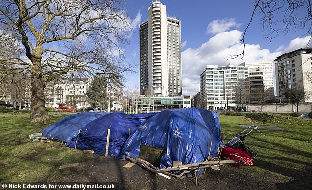 The shanty town outside is just minutes away from the infamous Park Lane homeless camp (pictured), which was dismantled after seven years before reopening 400 yards down the road